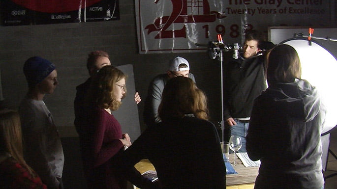 Students of the J-Term Gourmet Food Photography class set up a shot in the studio. foodpic3header